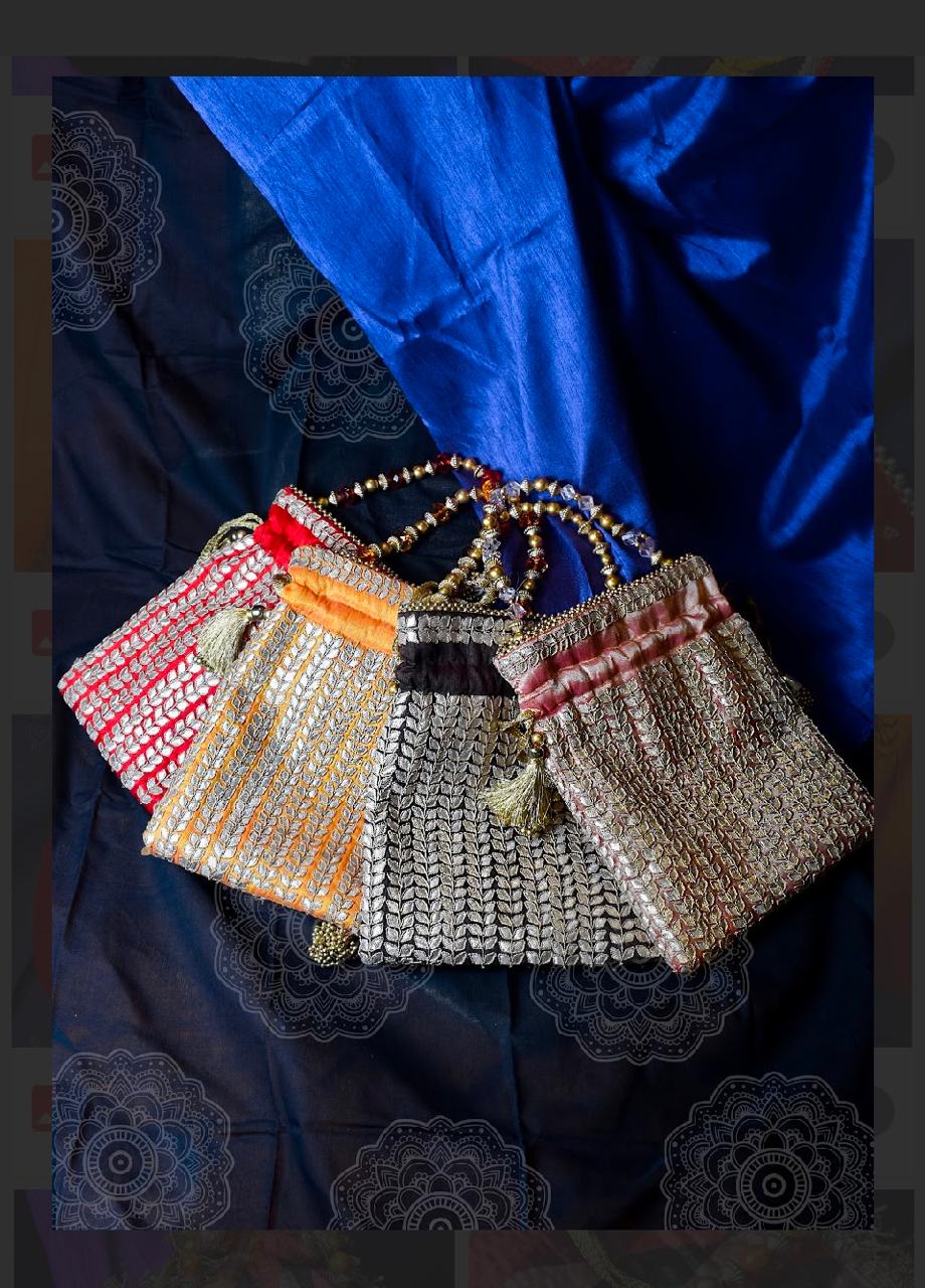 Gold Silk Potli Bag Set with Beaded Handles and Tassel Detailing