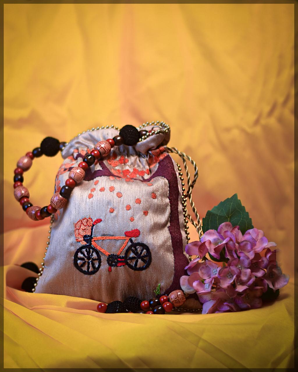 Silver Satin Potli Bag with Embroidered Bicycle Motif and Beaded Handle