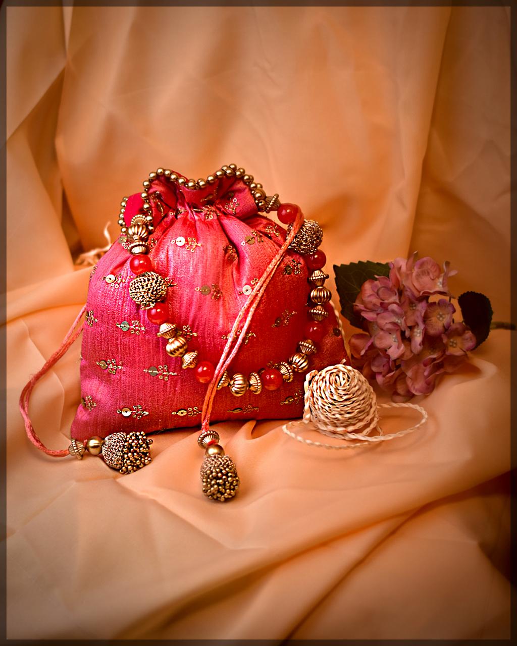 Pink Silk Potli Bag with Beaded Handle and Sequin Embellishments