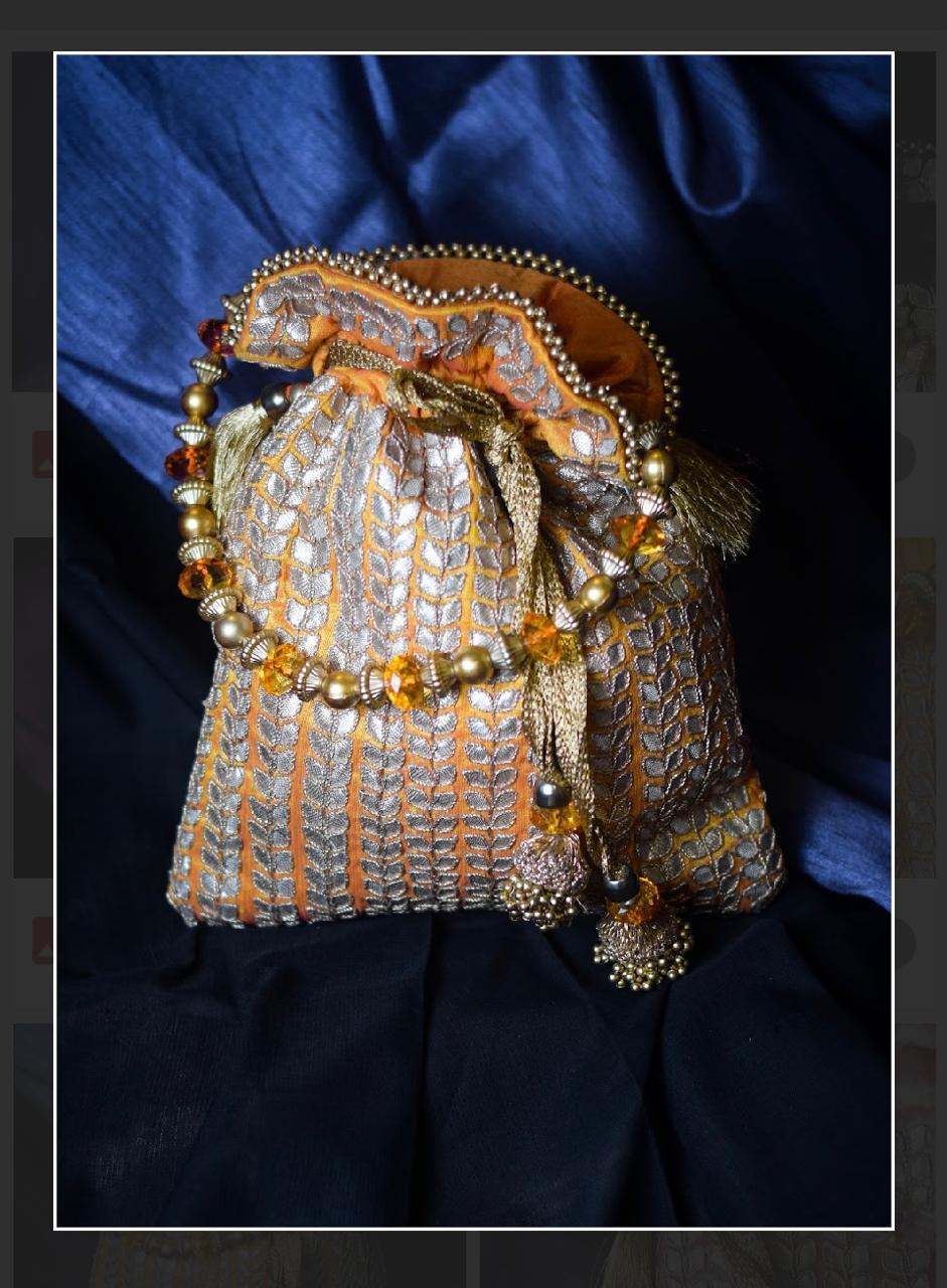 Orange Silk Potli Bag with Silver Embroidery and Beaded Handle