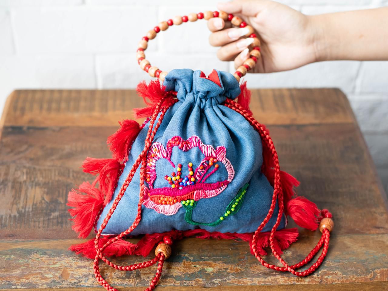Blue Cotton Potli Bag with Floral Embroidery and Beaded Handle