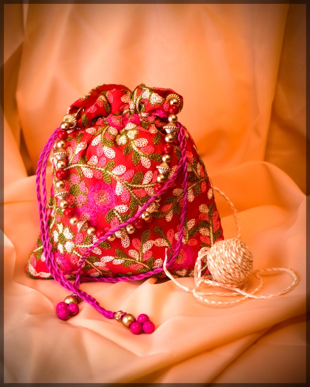 Pink Silk Potli Bag with Floral Embroidery and Beaded Handle